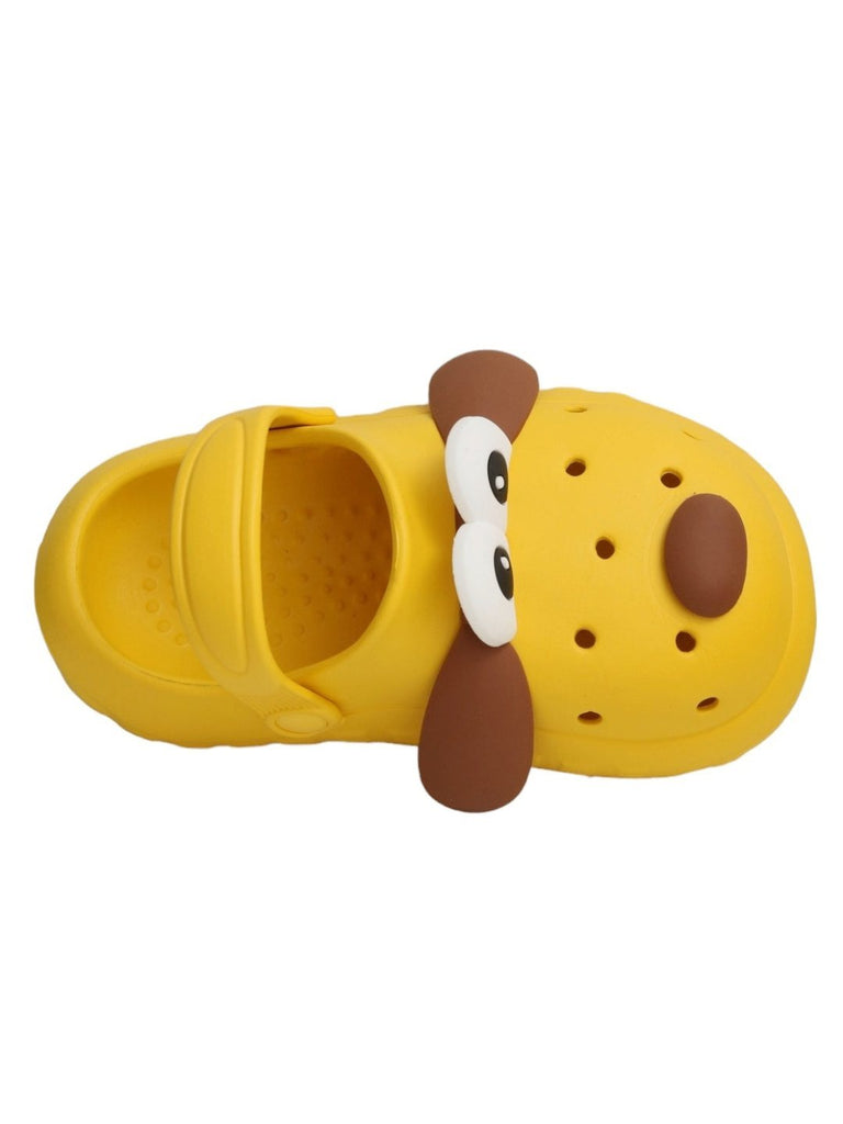 upper view of Yellow Bee Children's Puppy-Themed clogs with toy and cookies.