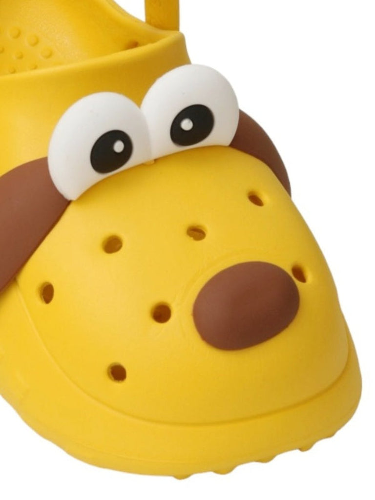 zoom view of Yellow Bee Children's Puppy-Themed clogs with toy and cookies.