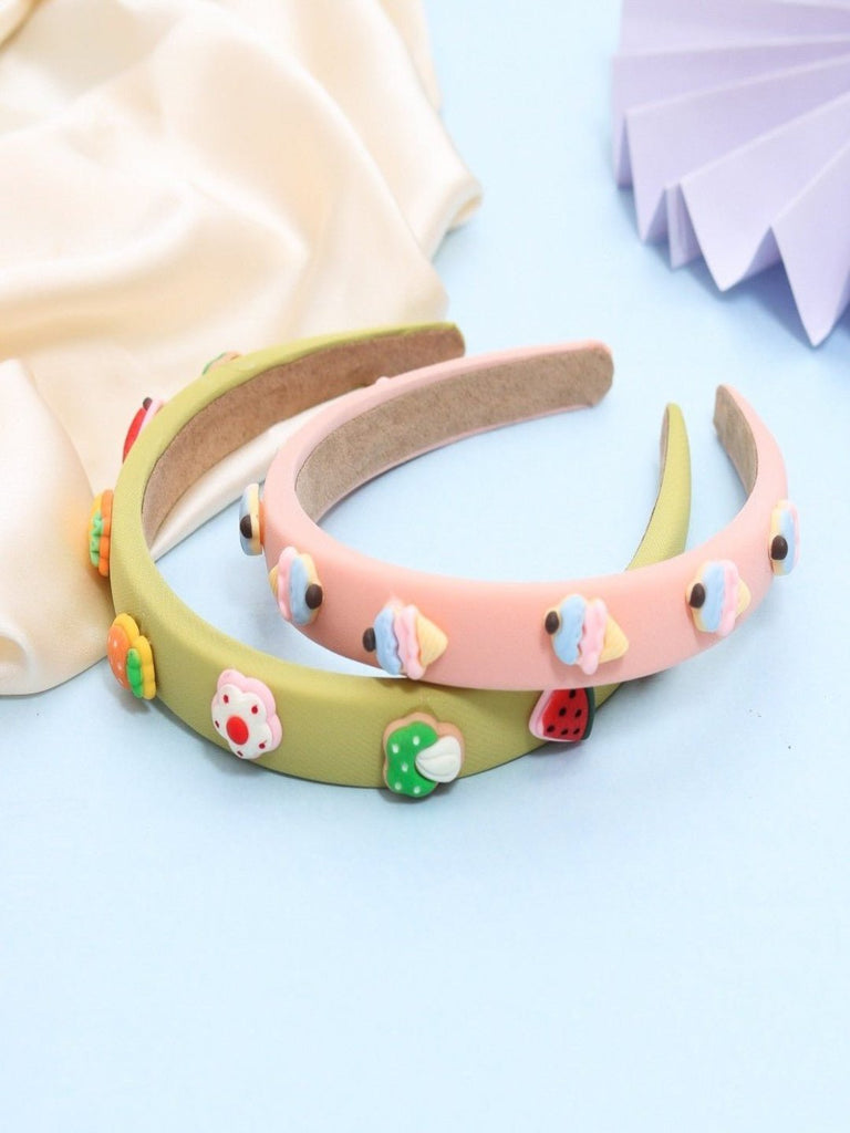 Creative shot of Yellow Bee's Dessert-Themed Hair Bands in Peach and Green for Girls