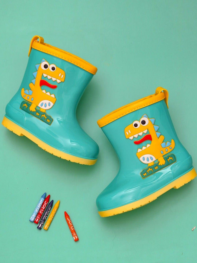 Creative display of Yellow Bee Dino Delight Green Rain Boots for Boys with playful background.