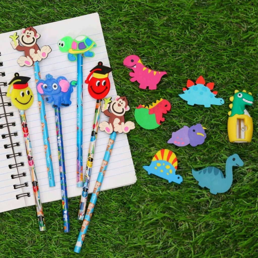 Assorted dinosaur-themed pencils from Yellow Bee on grass background