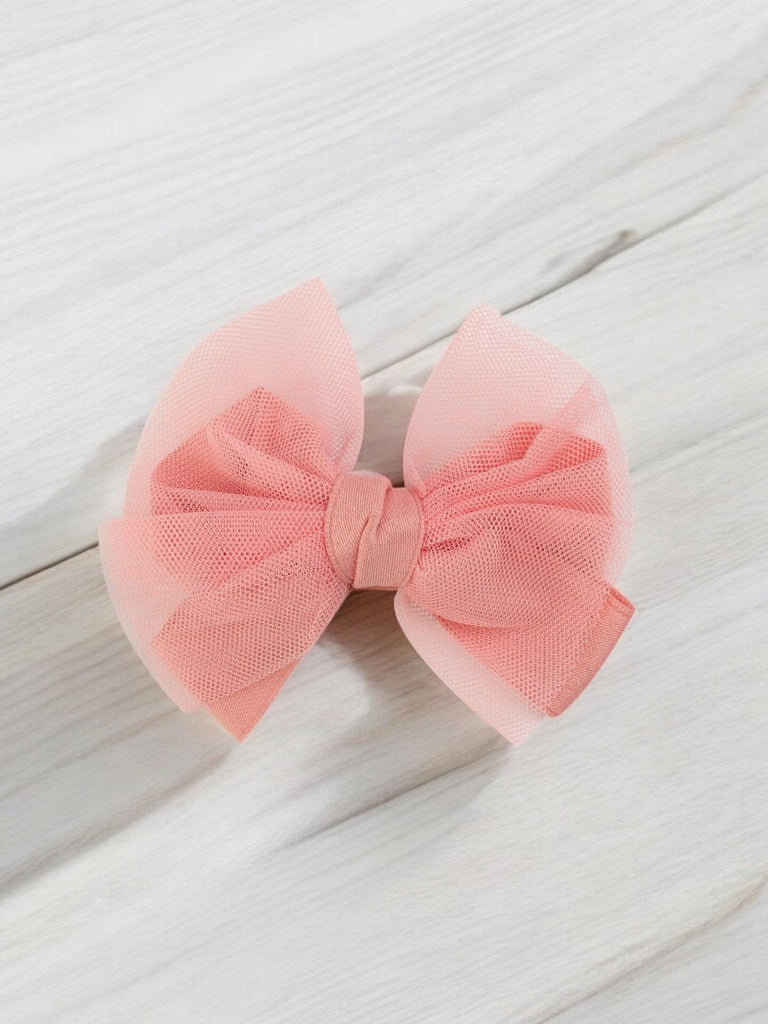 Creative view of the elegant peach tulle hair bow showcasing the soft net layers by Yellow Bee