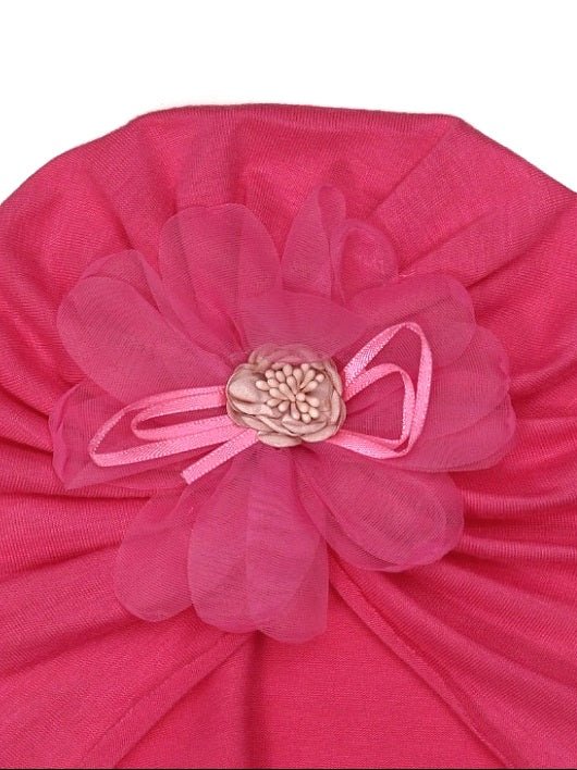 Close-up of the intricate flower detail on the Yellow Bee dark pink baby turban.