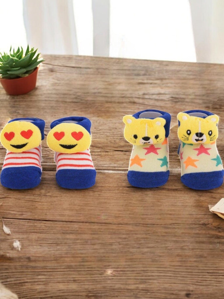 Emoji and Tiger Plush Socks Combo featuring heart-eyes emoji and tiger face designs with colorful stripes and star prints, displayed creatively.
