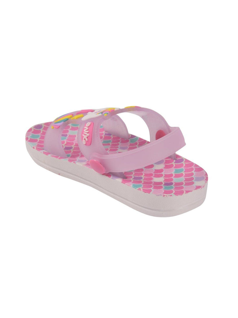  Full side profile of unicorn sandals with transparent straps against a white sole.