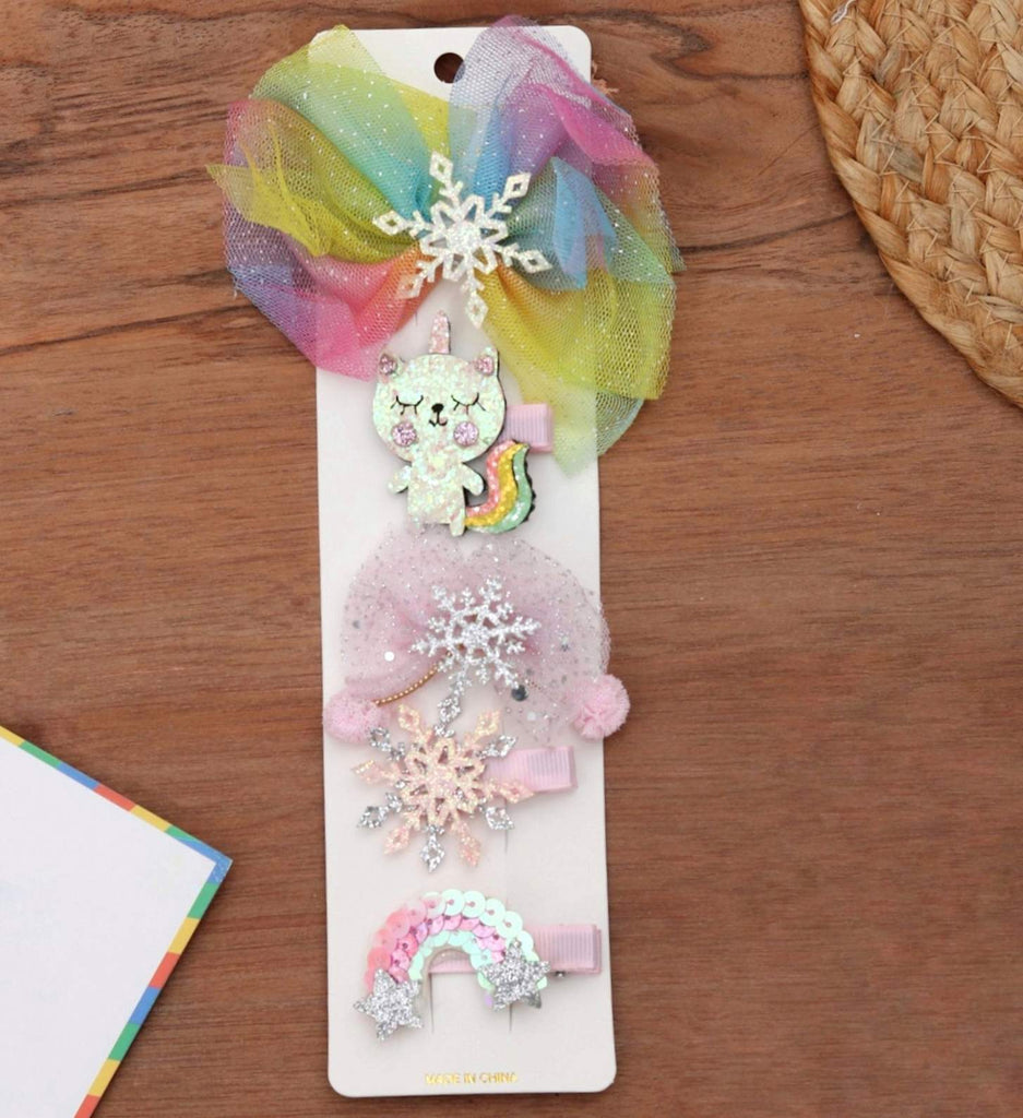Creative layout of Yellow Bee's rainbow-themed alligator clips set for playful hair styling