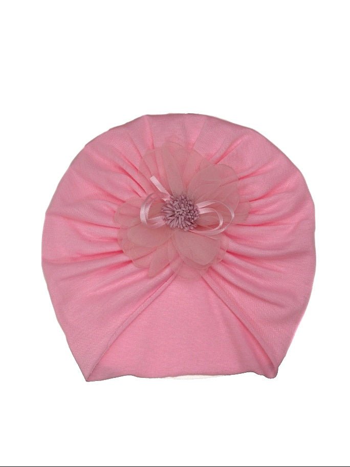 A charming light pink turban for baby girls with delicate flower detail by Yellow Bee.