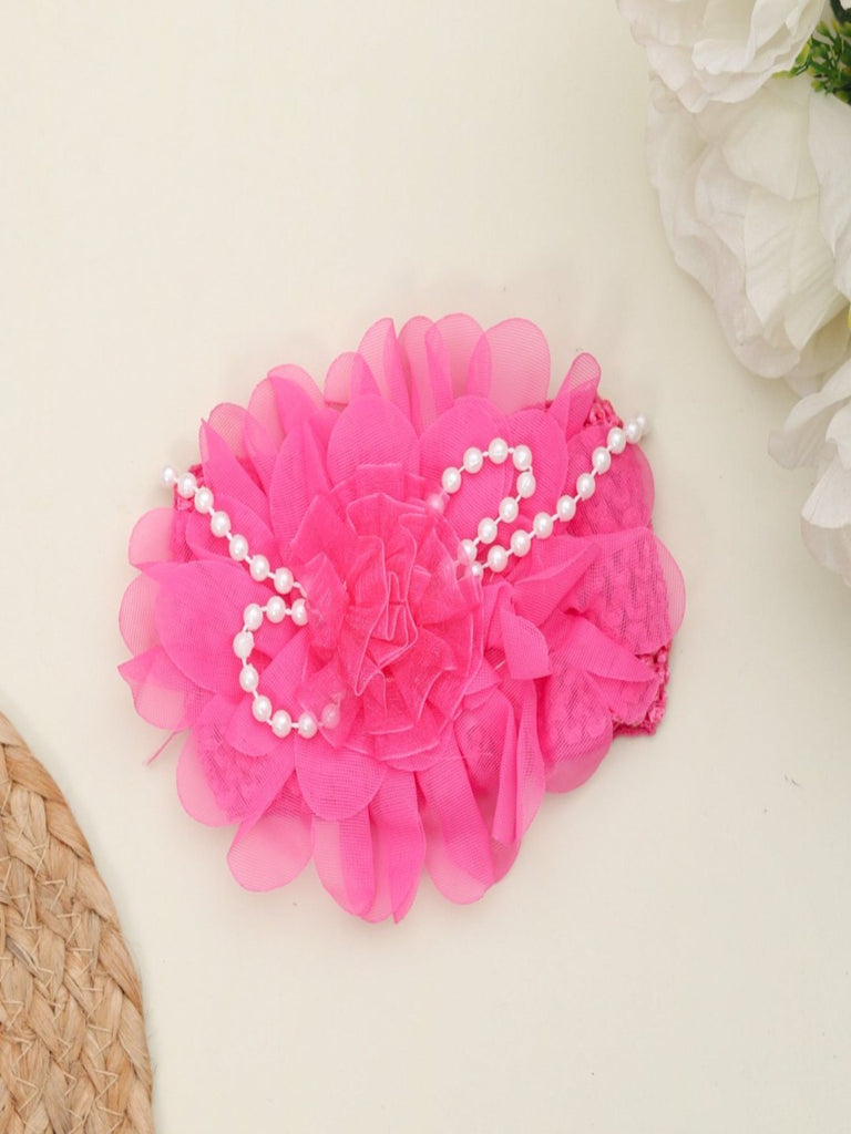 Creative view Yellow Bee Baby Headband with Floral Embellishments and Pearl Accents in Fuchsia - showcasing the stretchy elastic band.