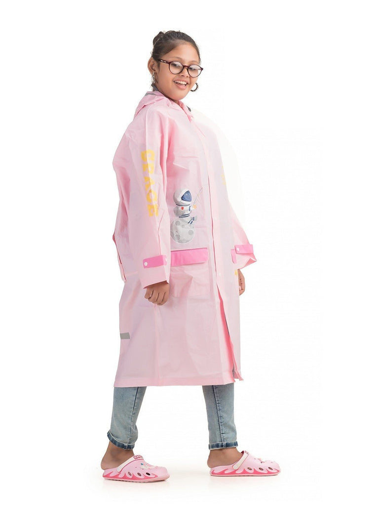 Side view of Yellow Bee girls' pink raincoat with astronaut and star graphics.