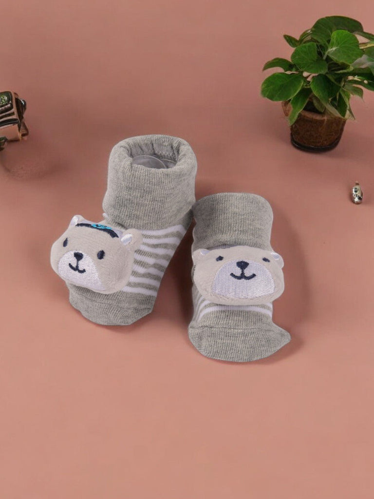  Creative view of Grey Baby Booties with 3D Bear Face featuring a playful bear design and striped pattern.