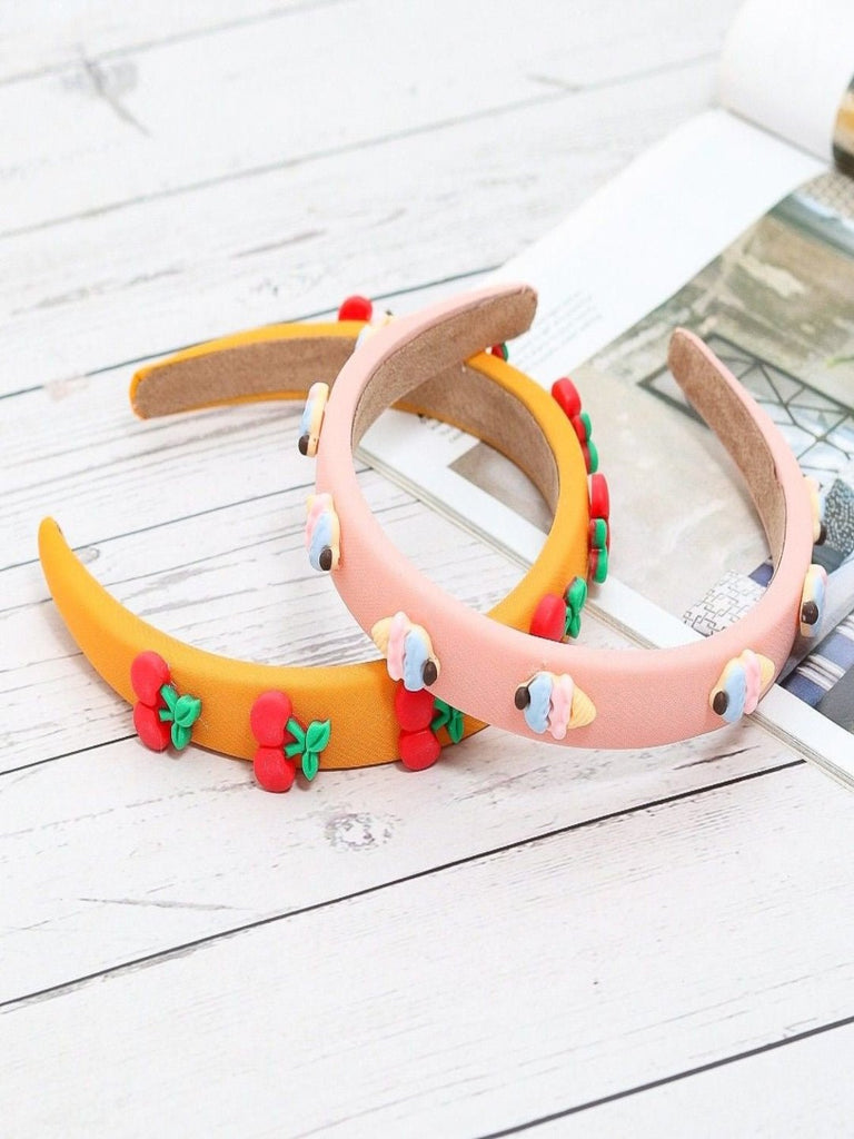 Creative image showcasing Yellow Bee's Peach and Orange Hair Bands with ice cream and cherry details.