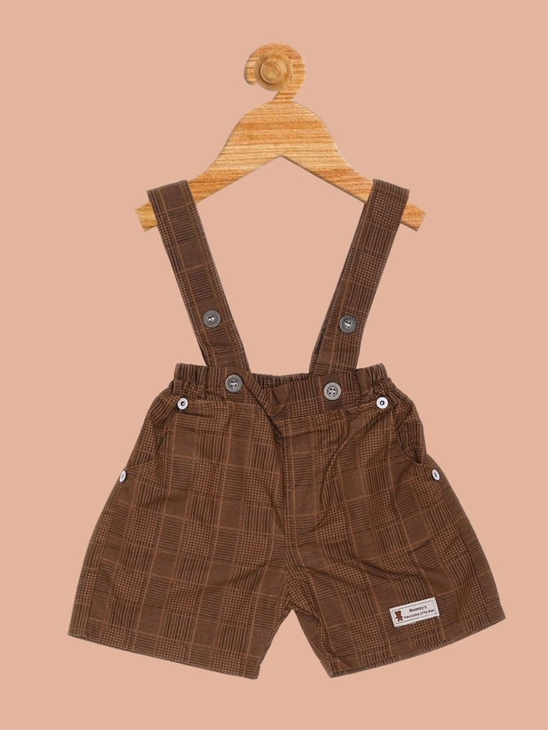 Close-up view of the 'Skateboy' graphic and plaid brown suspender details