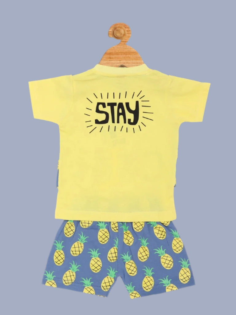 Back view of Jaybee boy’s pineapple print summer t-shirt and shorts set in yellow and gray.