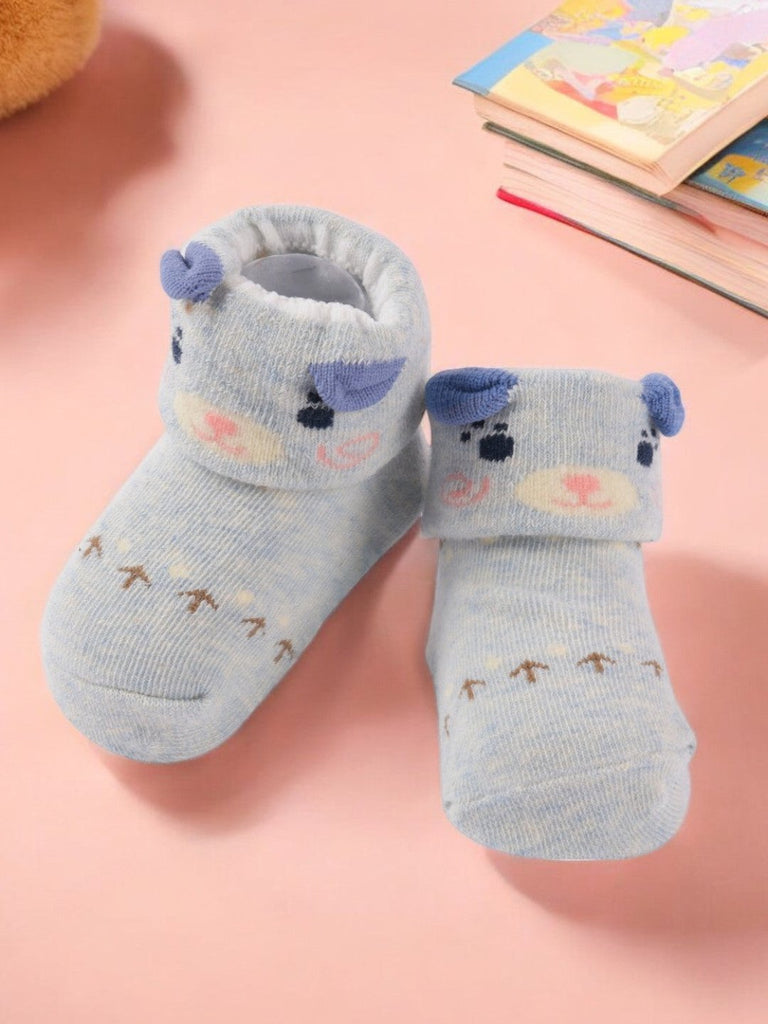 Creative view of Light Blue Baby Socks with Cute Bear Face and Ear Accents.