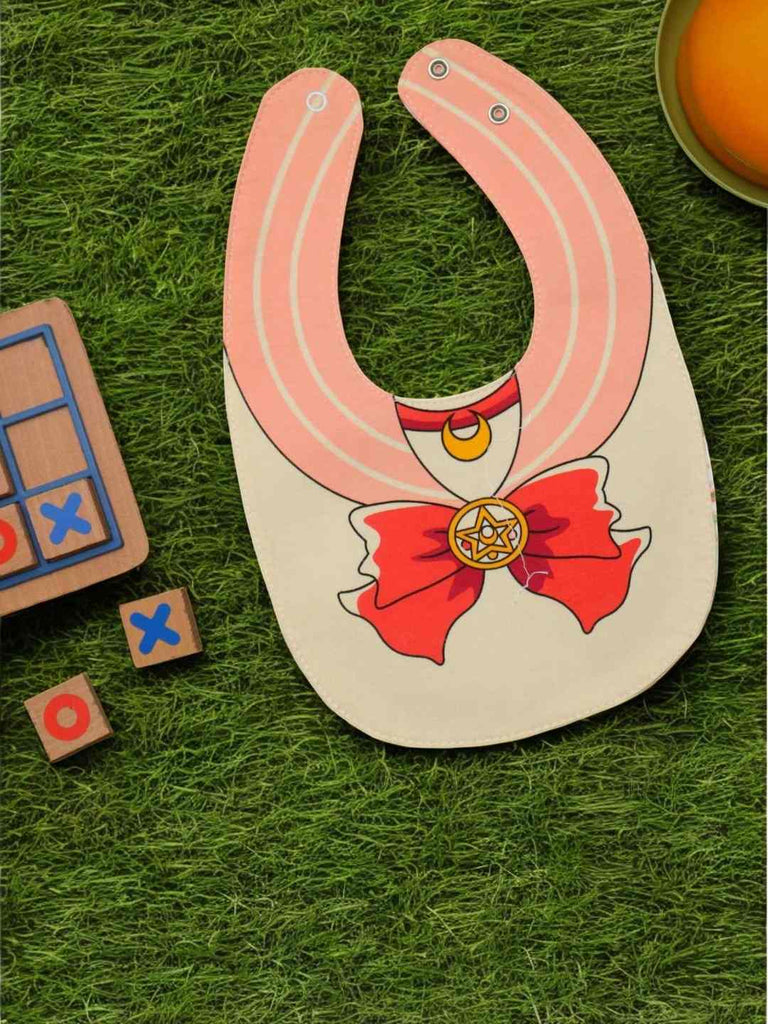 creativity display view of the Little Adventurer Cape Cotton Baby Bib for Girls.