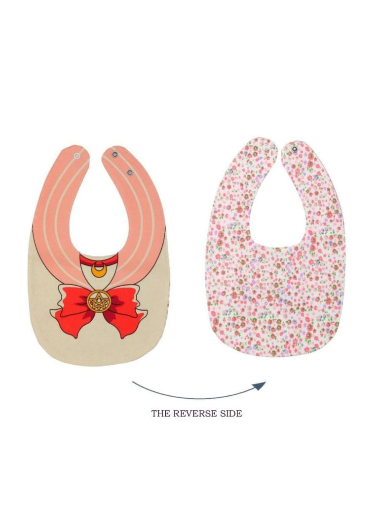 Full view of the Little Adventurer Cape Cotton Baby Bib for Girls showing both front and reverse designs..