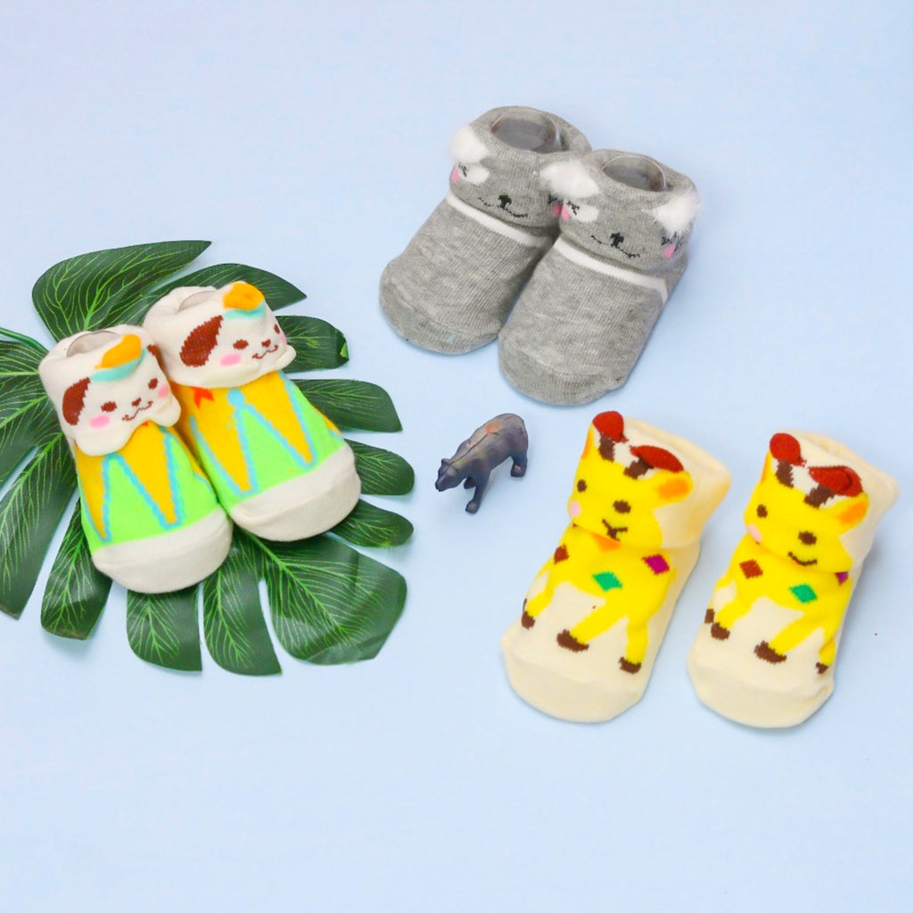 Baby Boy's Giraffe and Puppy Socks Set  Displayed with Toy Blocks.