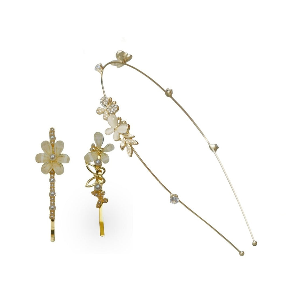 A graceful set of Yellow Bee hair accessories featuring a golden hairband and two hair clips with detailed acrylic butterfly and flower designs, presented against a white background.