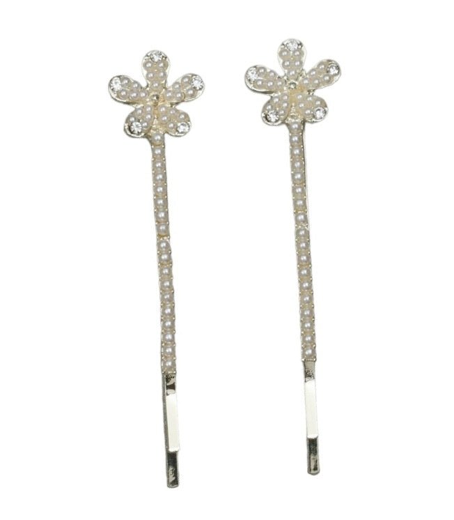 Two golden hair clips from Yellow Bee, each with a long stem and faux pearl flower, isolated against a white backdrop for a clear view.