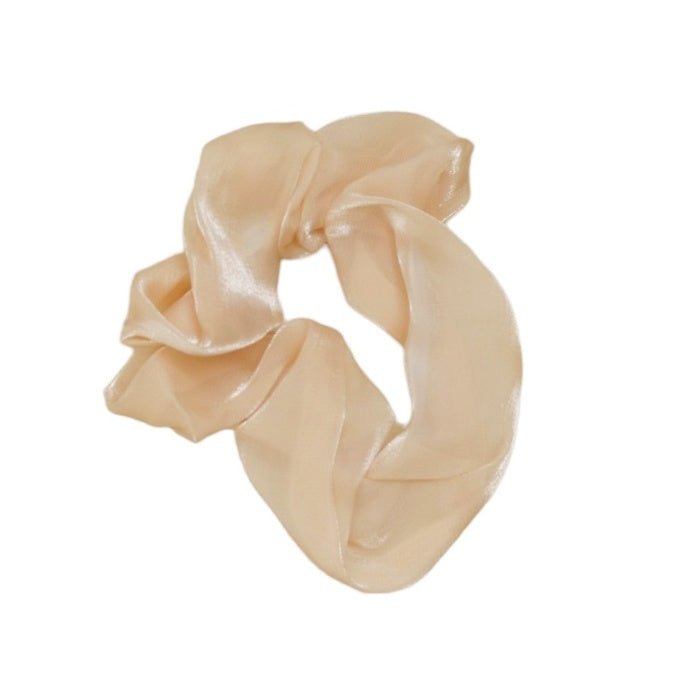 Close-up of the luxurious Glossy White Silk Scrunchie by Yellow Bee