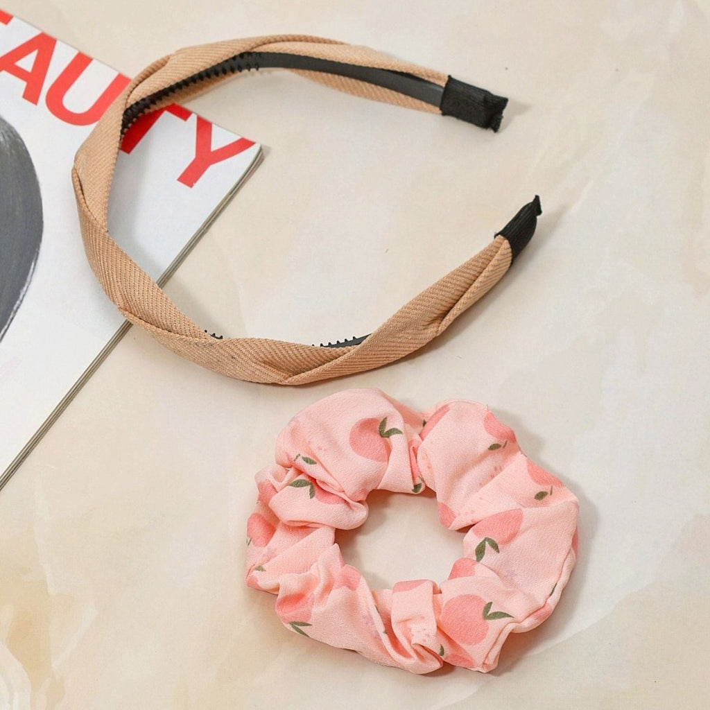 Stylish presentation of Yellow Bee's beige hairband and peach scrunchie set against a chic background.