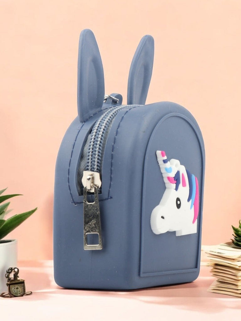 Navy Bunny-Eared Coin Pouch with Colorful Unicorn Design shown creatively with cute props