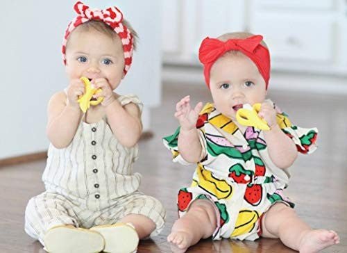 Two babies using Nuby Nana Nubs (Banana) Teething Toothbrush.