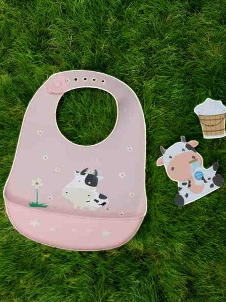 Creative display of Pastel Daisy Cow Silicone Baby Bib for Girls