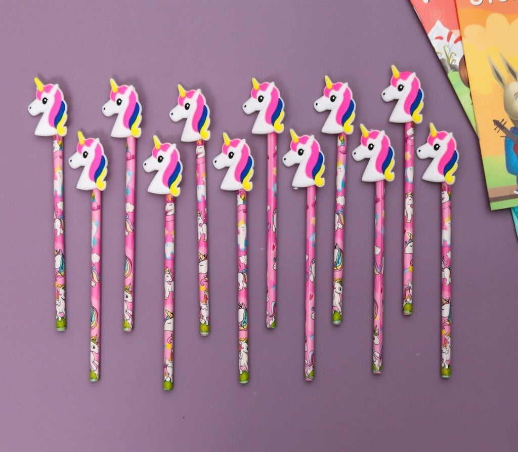 Full set of 12 Yellow Bee pencils with unicorn motifs arranged on a purple background.