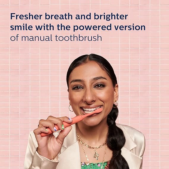 User displaying a brighter smile with Philips Sonicare Electric Toothbrush
