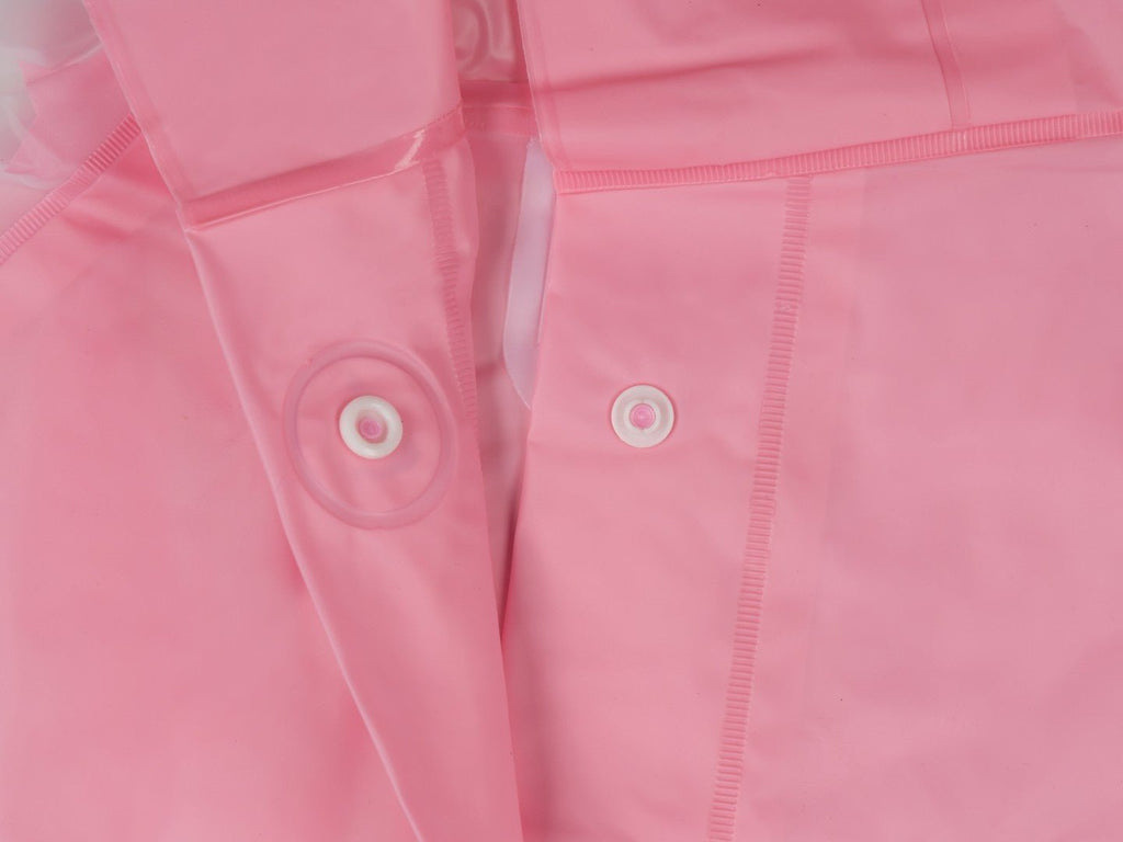 Close-up view highlighting the button closure and unicorn design of the Pink Unicorn Raincoat for girls.