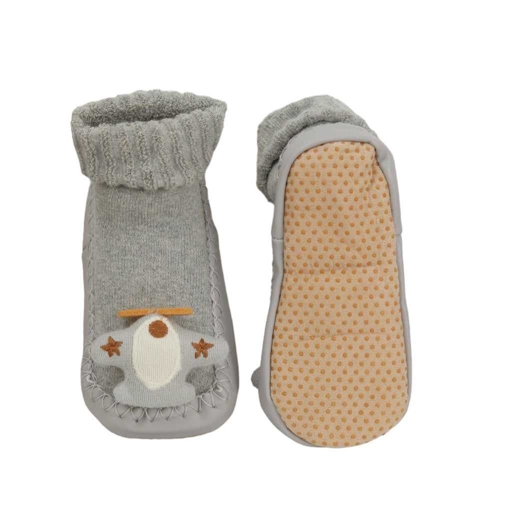 Top and bottom perspective of kids' aviator aeroplane  socks featuring the anti-slip sole and detailed aircraft design