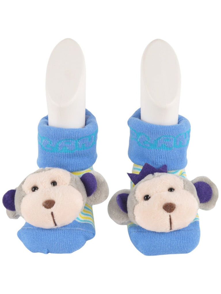 Front view of baby’s playful socks with a monkey plush accent and vibrant blue tones.
