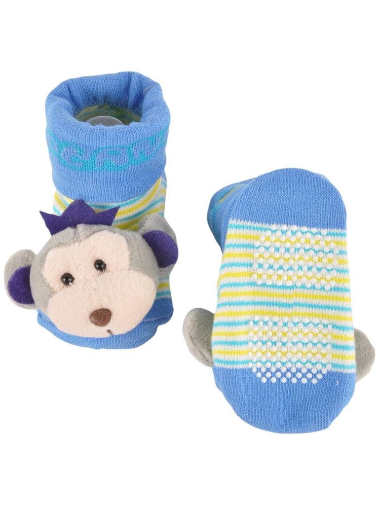 Front and back view of baby’s blue monkey plush socks, showing anti-slip grips and playful design.