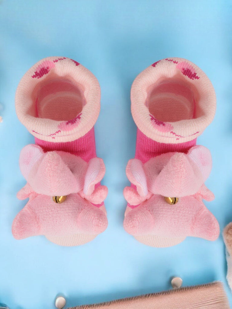 Pair of Yellow Bee's pink elephant plush socks for babies, displayed with a clear view of the top and stuffed animal design creative view