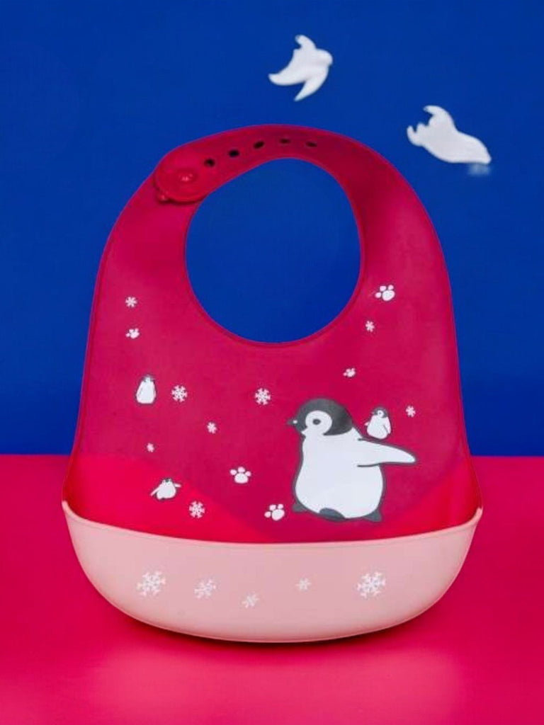 Creative display of Playful Penguin Silicone Baby Bib for Girls against a playful background