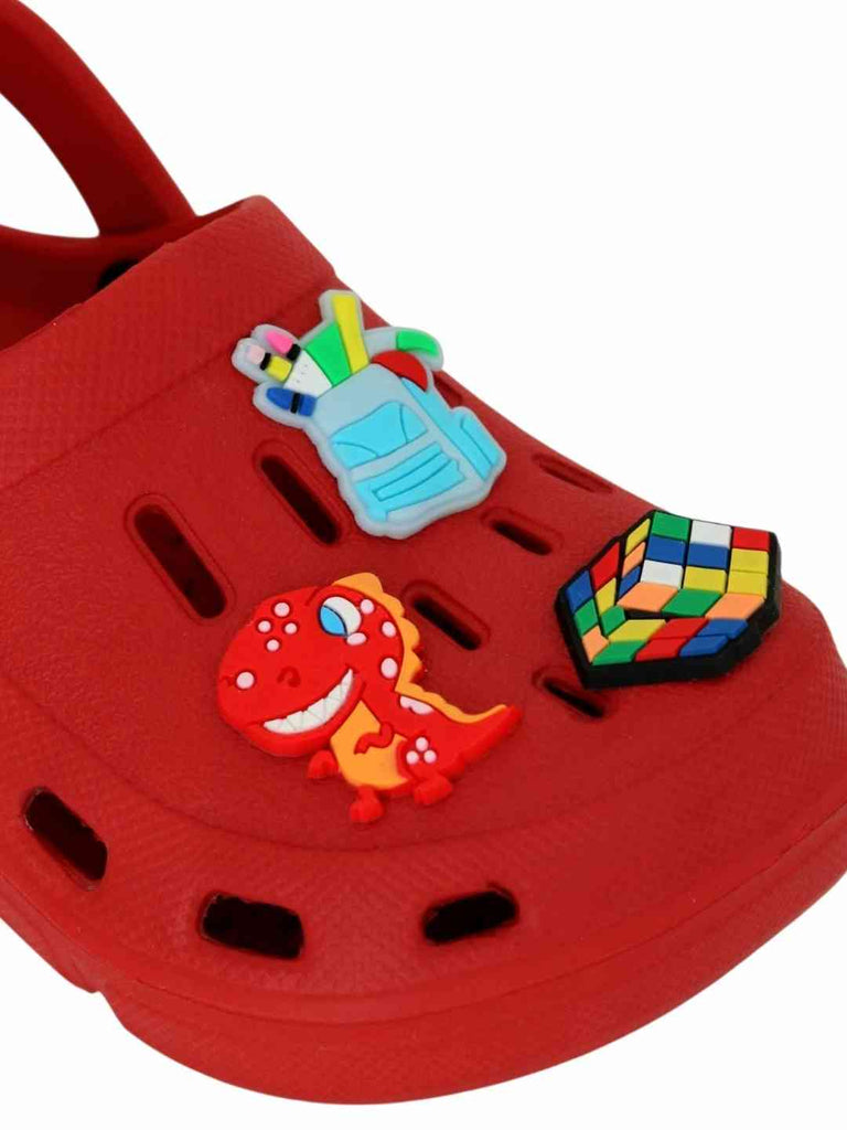 Playful Red Clogs with Backpack, Dinosaur & Puzzle Cube Charms for Boys- Close up view