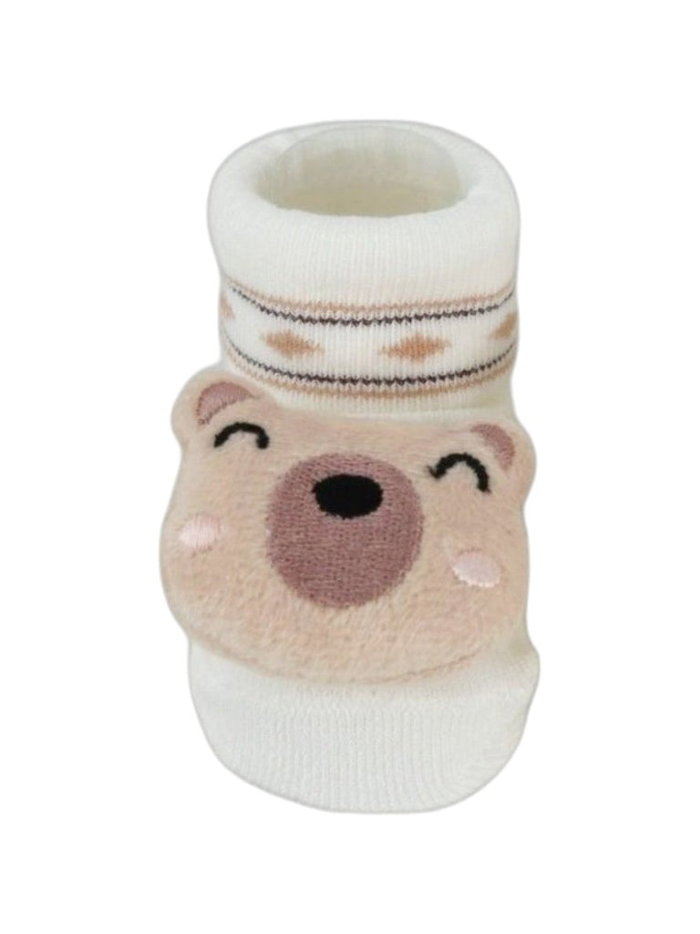 A close-up of the plush bear face on these soft and cozy baby socks.