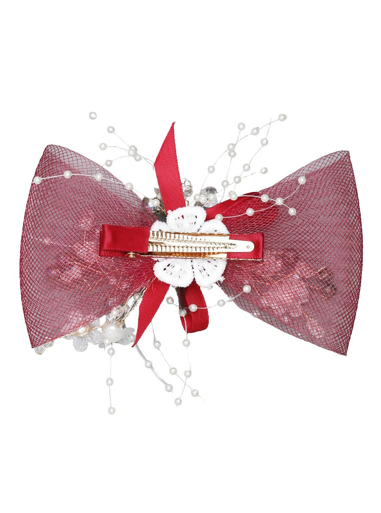 Back view of Yellow Bee's embellished red headdress bow hair clip showcasing the alligator clip.