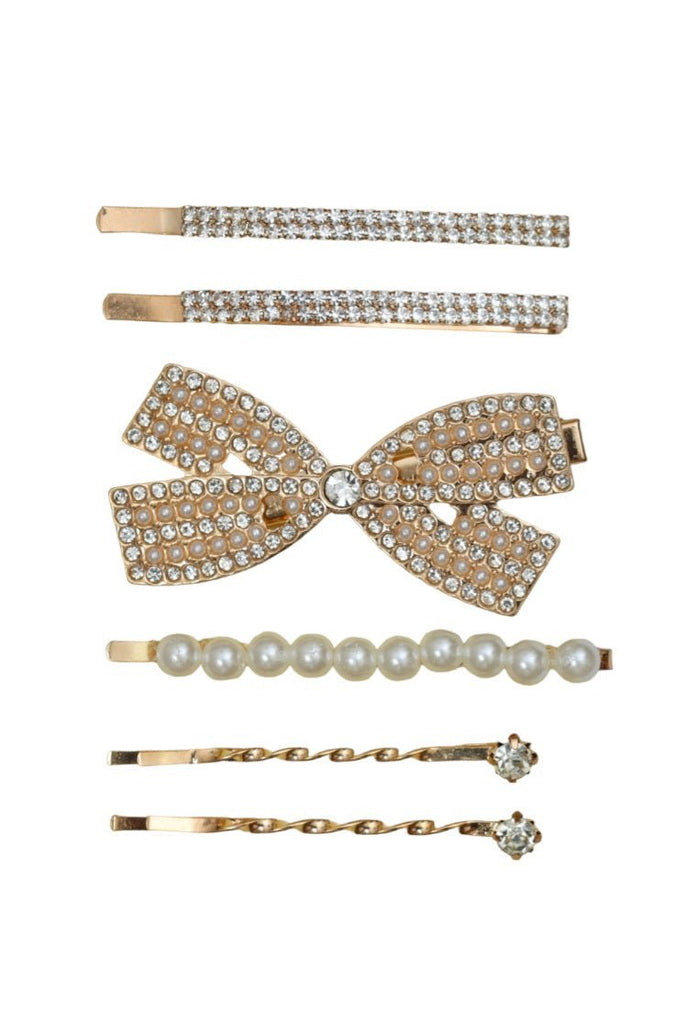 Elegant collection of golden and white hair clips featuring rhinestones and pearls, designed by Yellow Bee for special occasions.