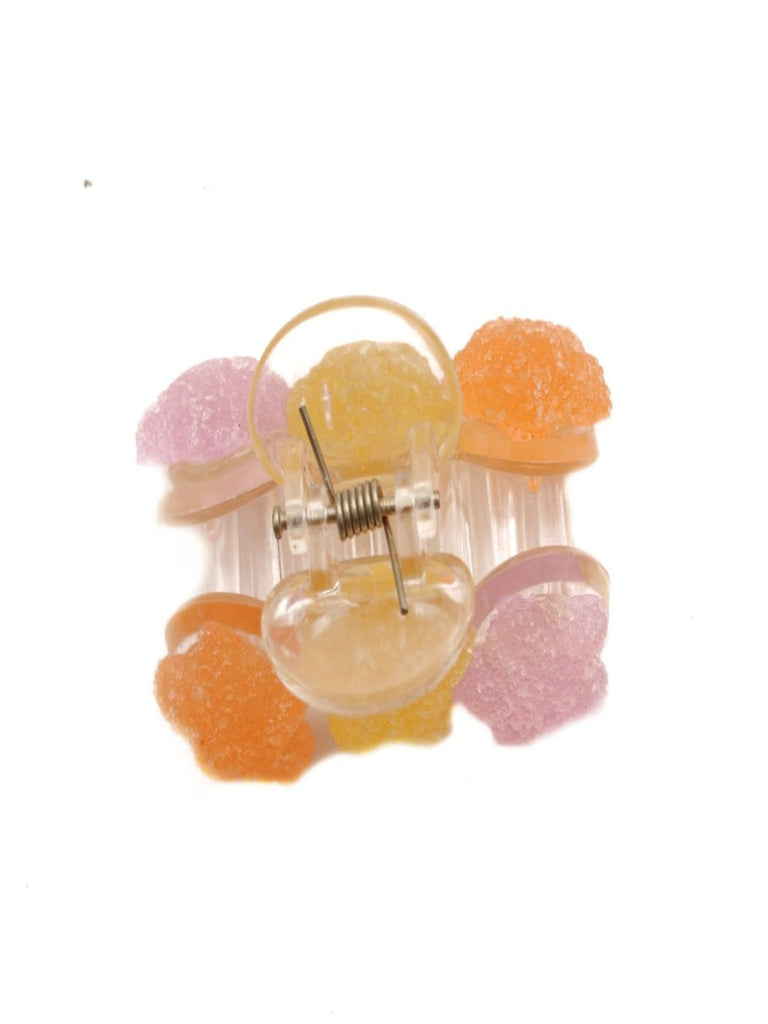 Front view of Shimmering Candy Star Hair Claw Clip in pastel hues of orange, yellow, and lavender.