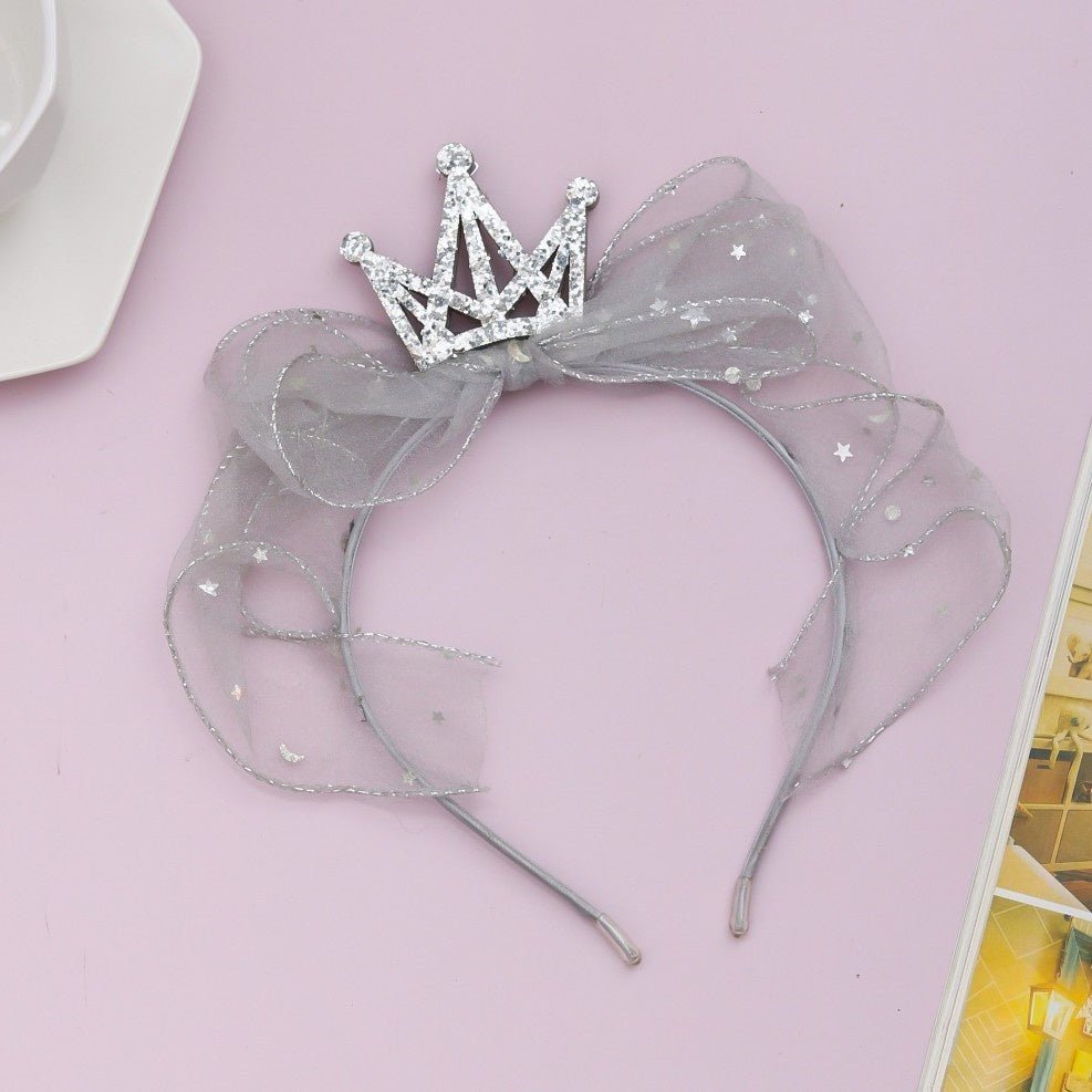 Silver crown hairband with lace by Yellow Bee displayed creatively, showcasing its elegance and charm.