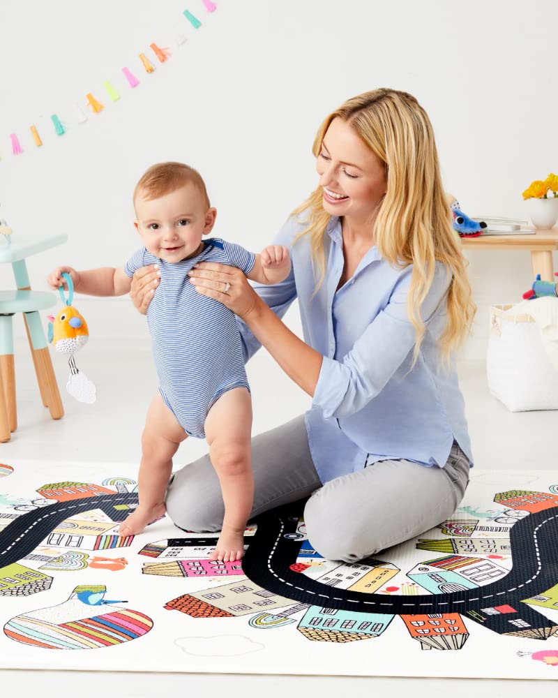 Skip Hop Doubleplay Reversible Playmat folded for easy storage, showcasing the compact and portable design.