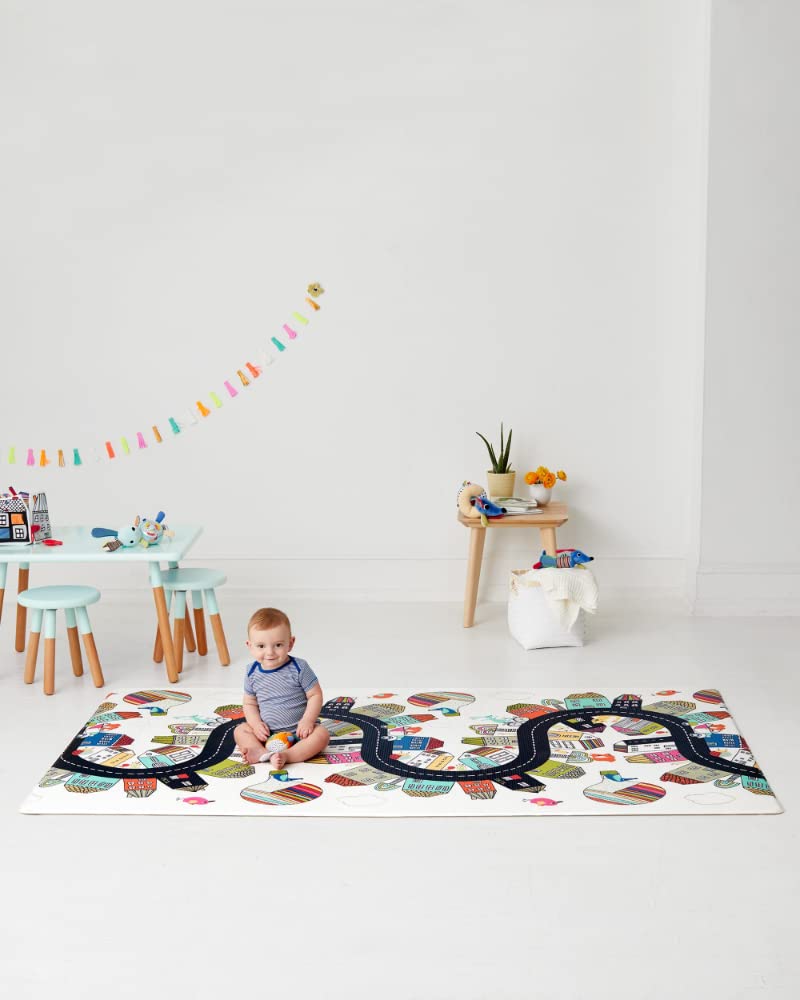  View of Skip Hop Doubleplay Reversible Playmat folded for easy storage, showcasing the compact and portable design