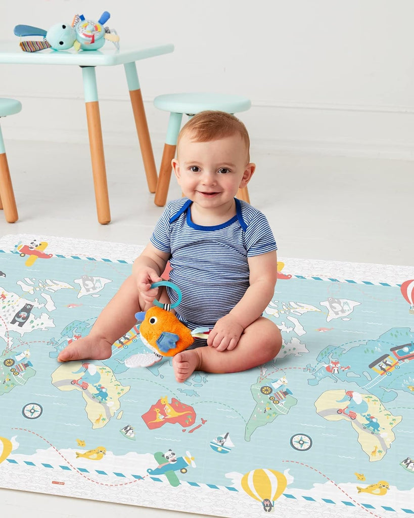  Image of a baby enjoying playtime on the Skip Hop Playspot Geo Playmat, demonstrating its use in a child-friendly setup.