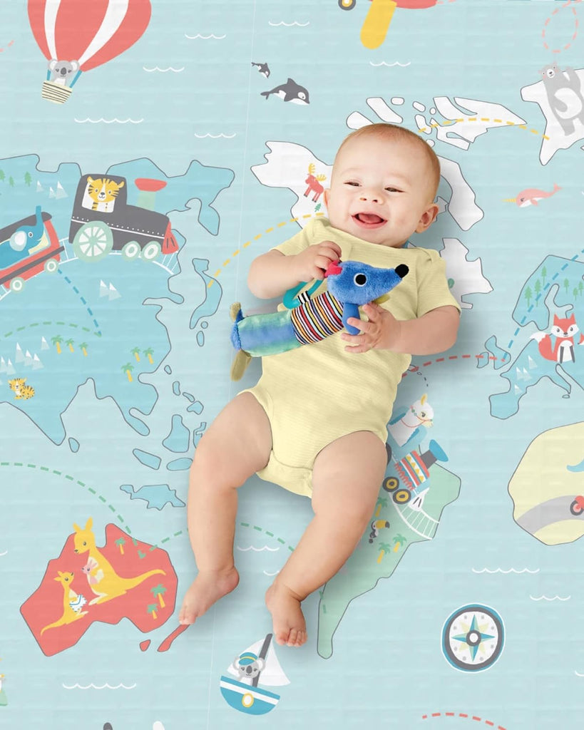 Skip Hop Playspot Geo Playmat folded for easy storage, showing its portable design.