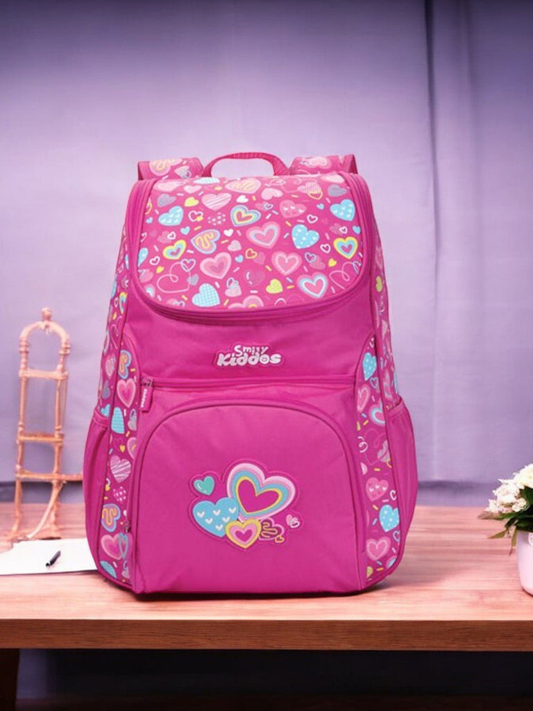 Frontal display of the Smily Kiddos Light Blue U-Shape Backpack, showcasing the heart pattern and functional pockets.