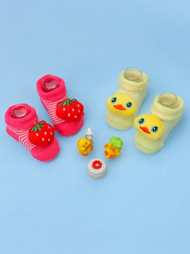 Colorful stuffed toy socks set with strawberry and duck designs for infants.