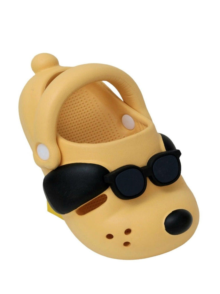 Angle view of the Sunny Shades Boy's Clogs in cheerful yellow showcasing the playful puppy design and secure sling back.