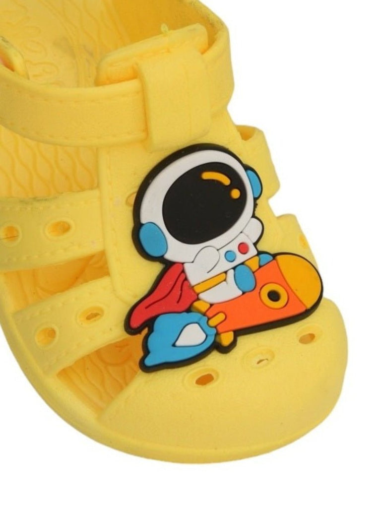 Close Up View of Yellow Astronaut Rocket Sandals for Boys displayed with space-themed accessories, perfect for imaginative play.